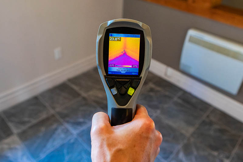 Thermal imaging camera being used while preforming home inspection services